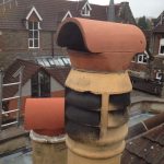 Dangerous Saddle Cowl fitted to live flue